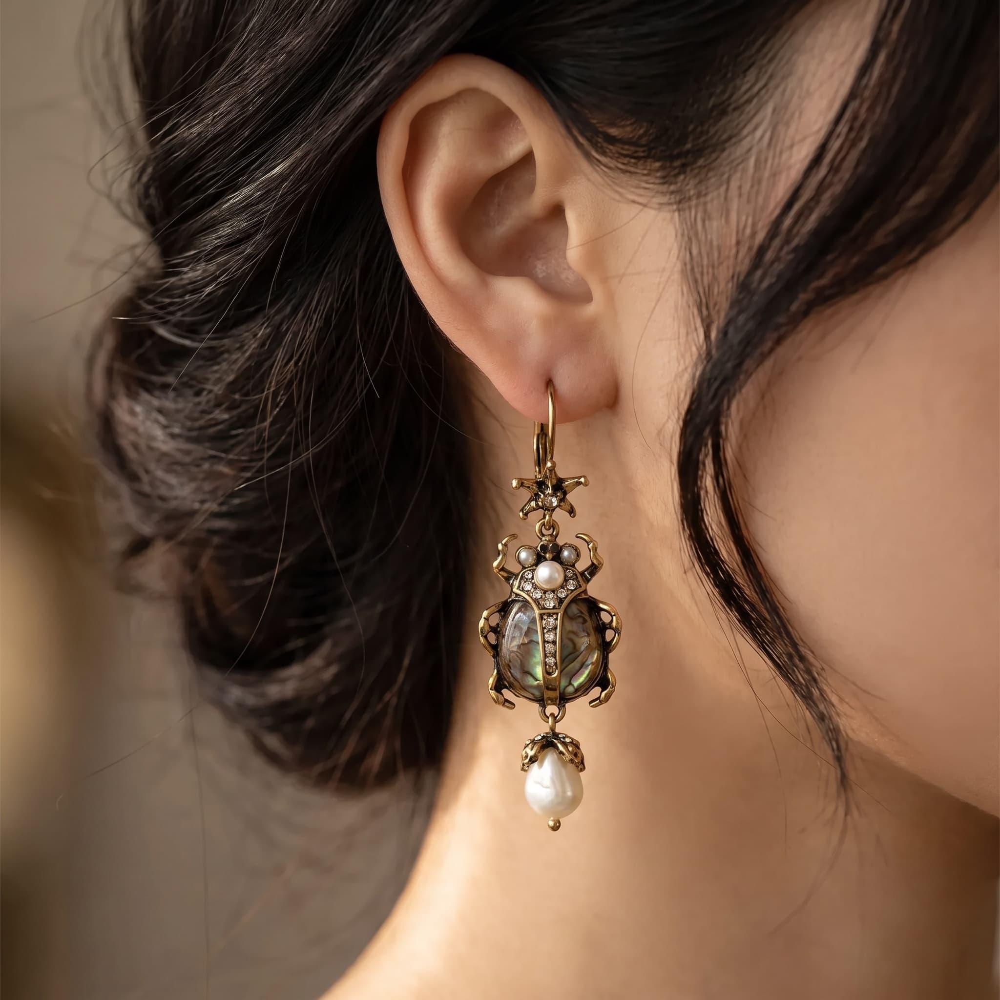 Antique Brass Scarab Beetle Pearl Drop Earrings worn by model